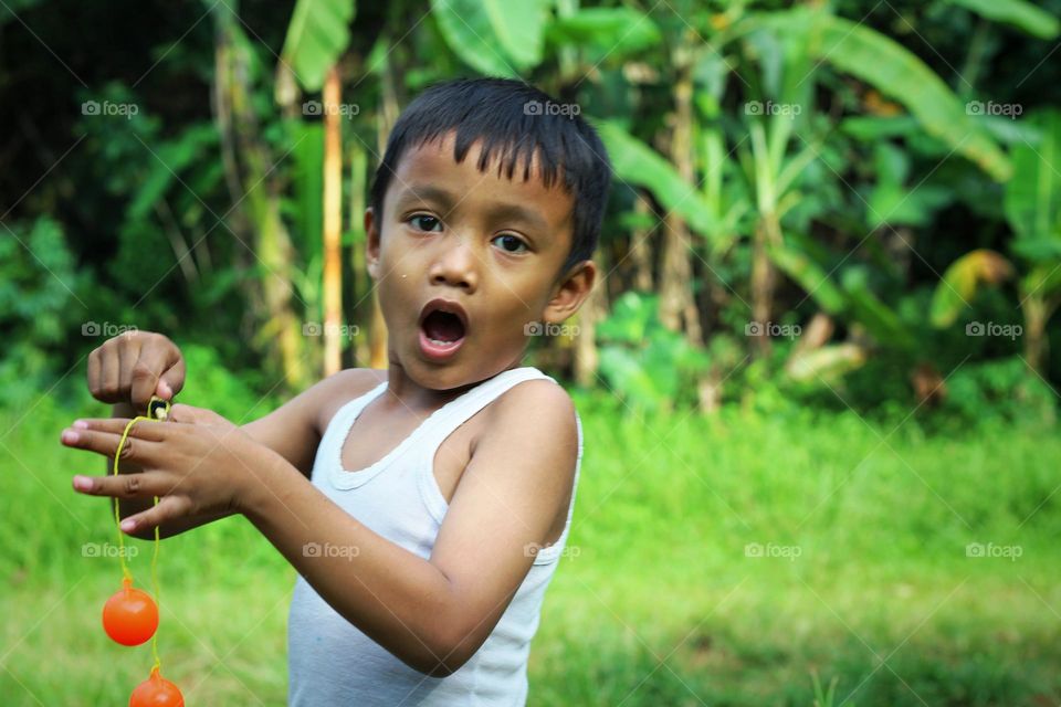 portrait of a boy in the field.