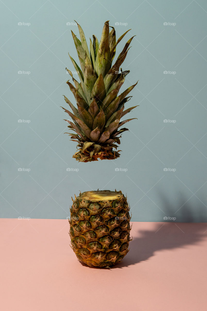 Pineapple with one half floating
