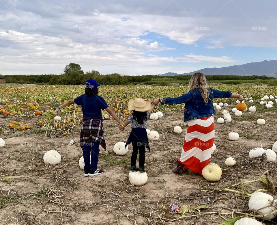 Mother , Daughter and Son Enjoying Harvest Time 