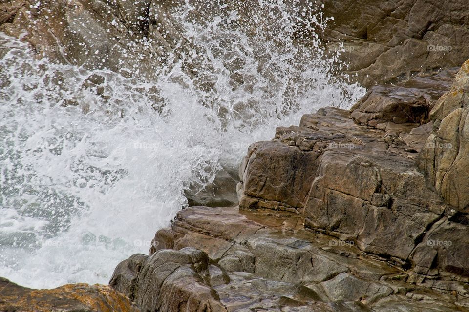 water flowing into the rocks