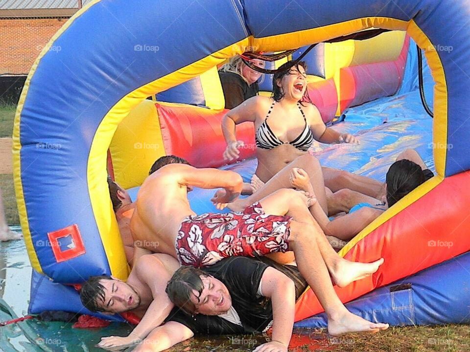 Group of people enjoying ride in waterpark