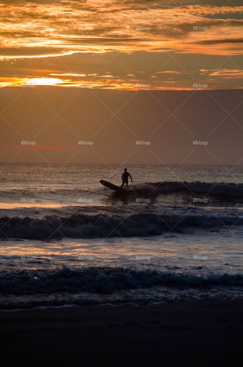 Silhouette of person at beach