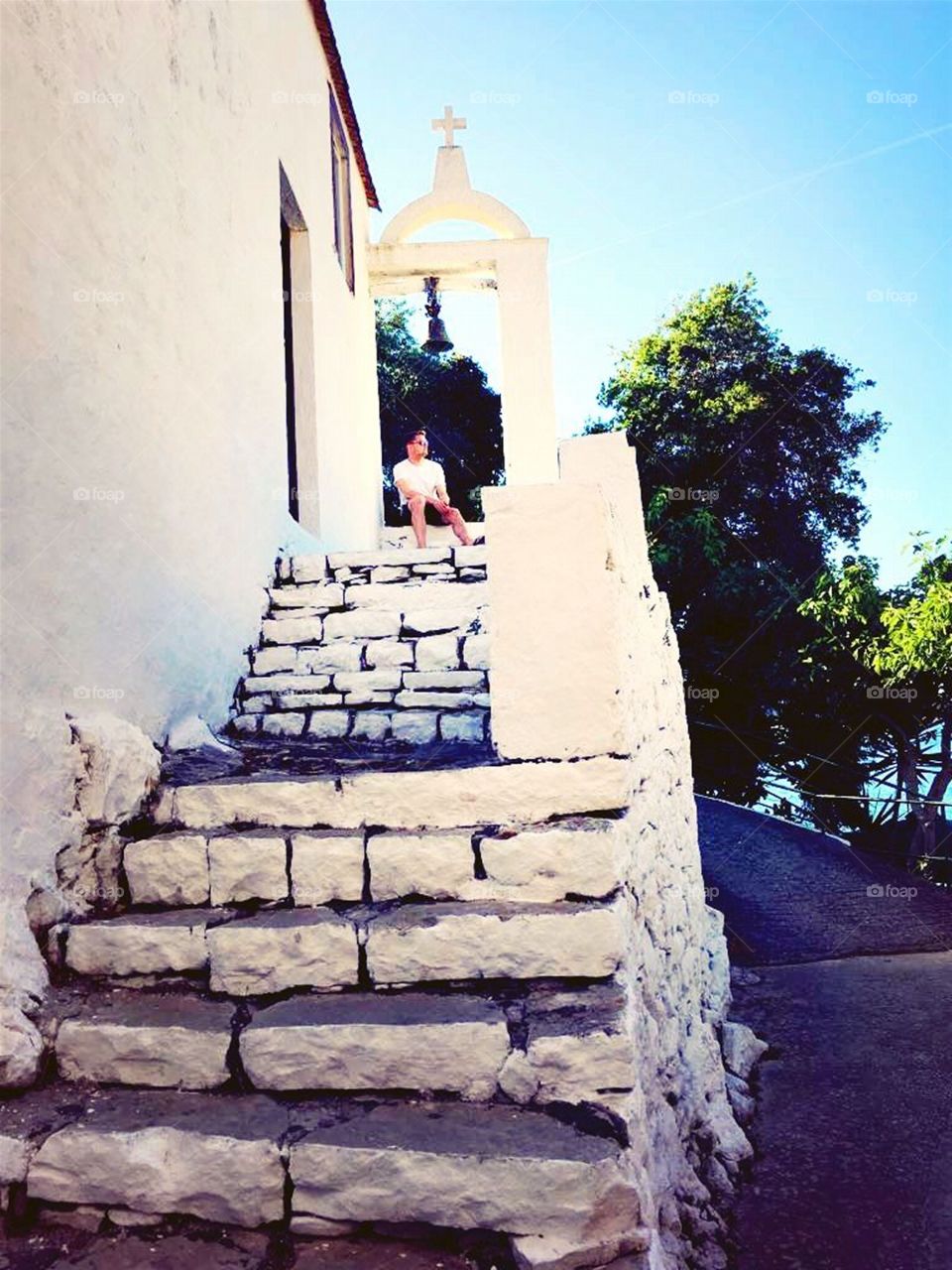 Man Sitting in a Traditional Greek Church Doorway, Paxos, Greek Islands