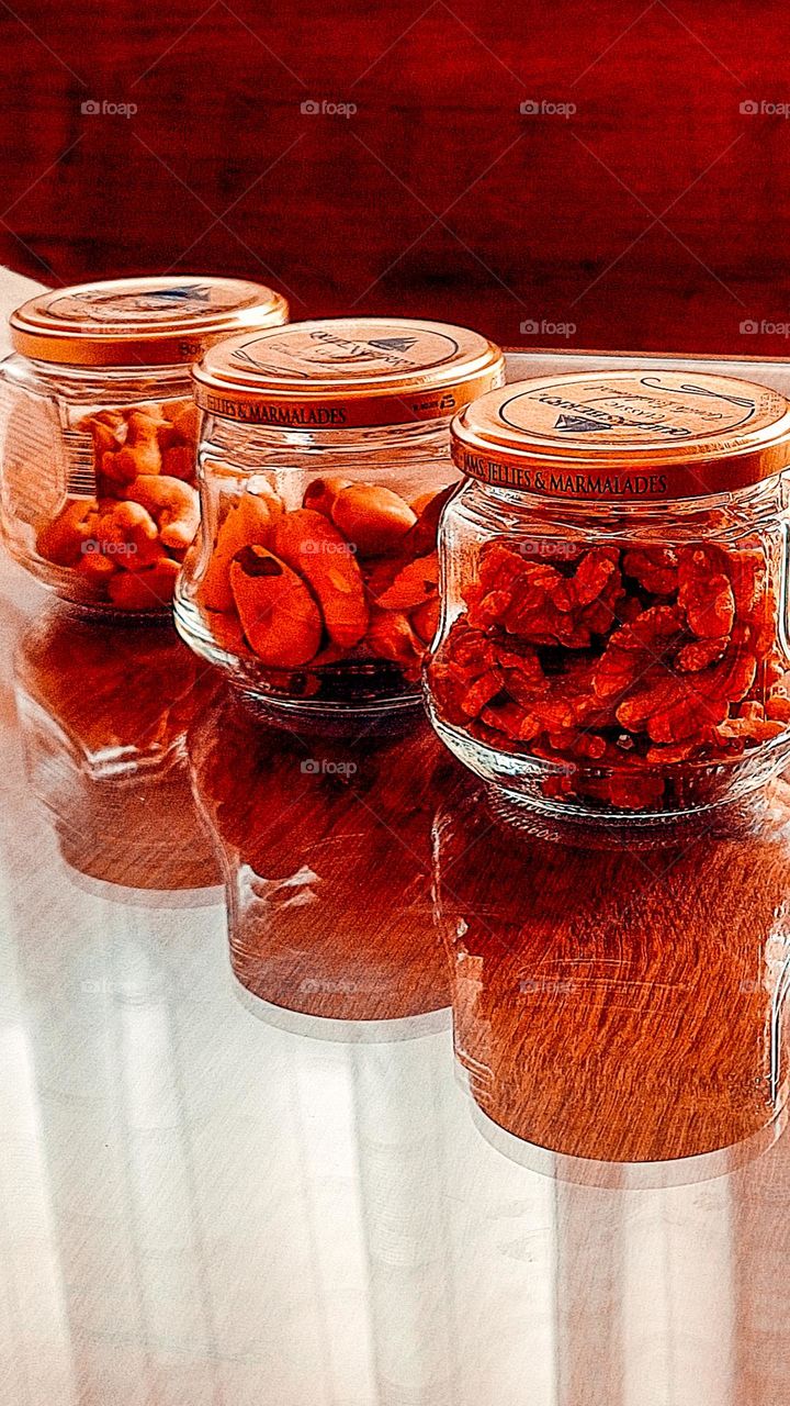 Brazil Nuts, Nuts and Cashew Nuts packed in glass jars.