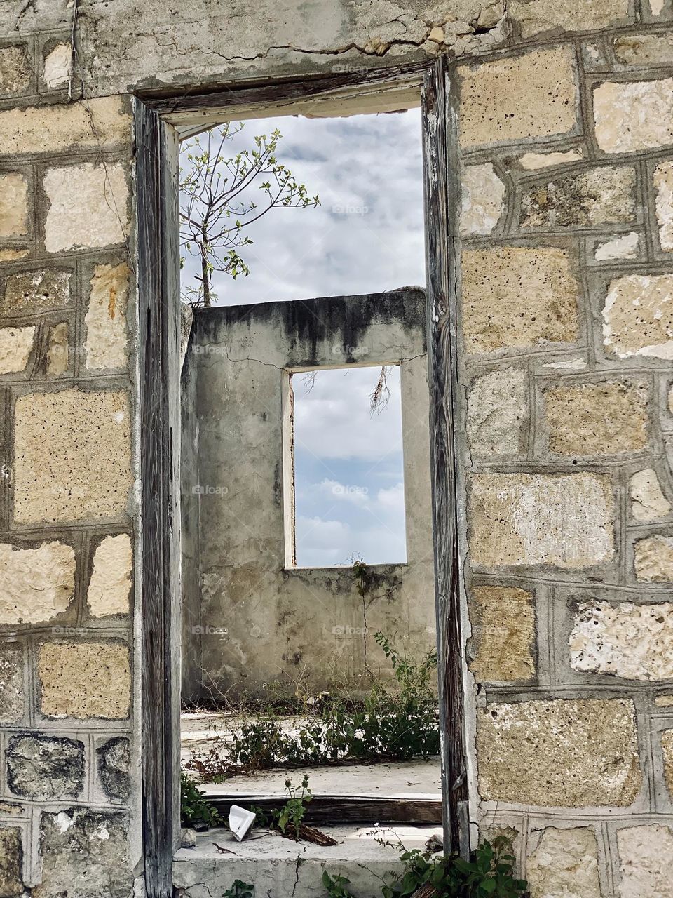 Looking through a door and a window in an old building