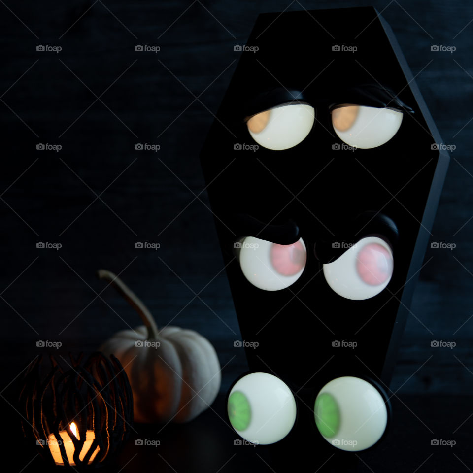 1:1 square image of glowing eyes Halloween decorations 
