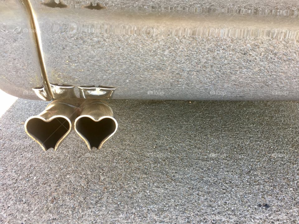 Heart shaped 1961 chrome  tail pipes on classic car 