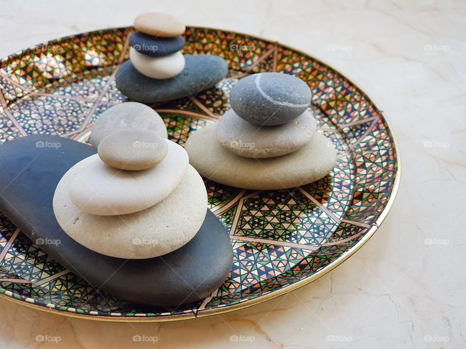 colourful pebbles arranged on a beautiful plate