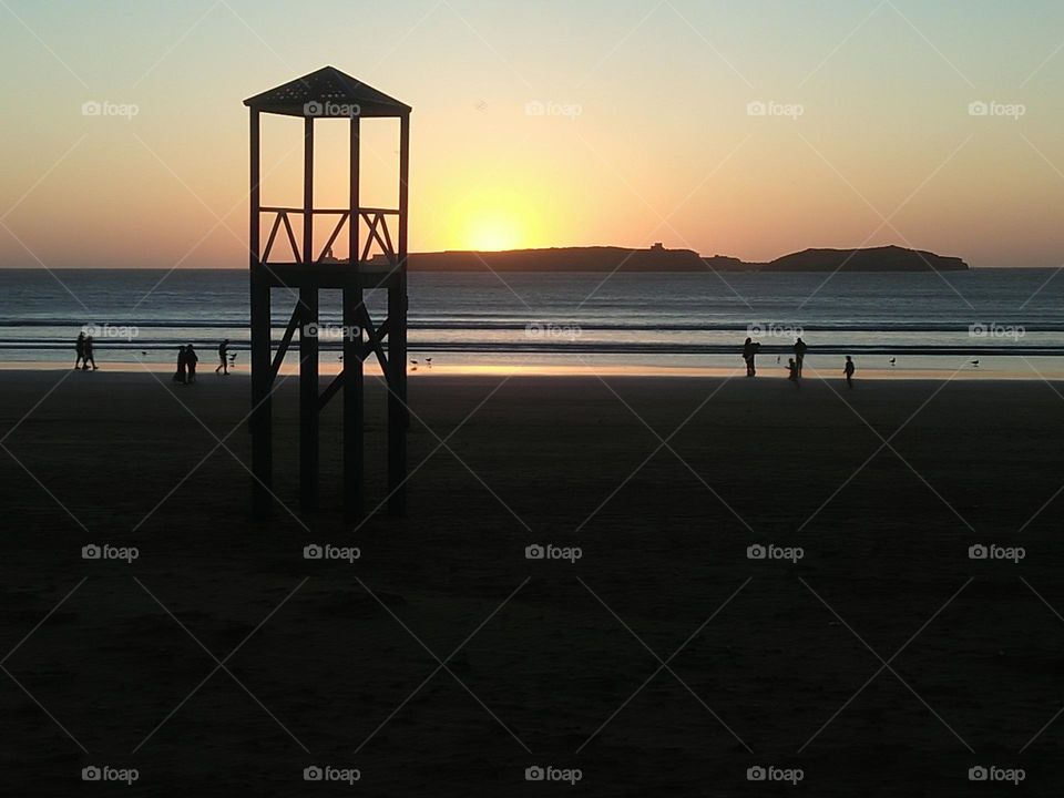 Beautiful sunset and people around the beach at essaouira city in Morocco.