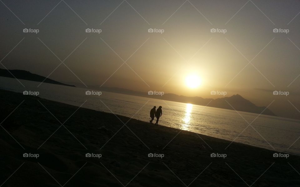 people at the beach [ sunset ]