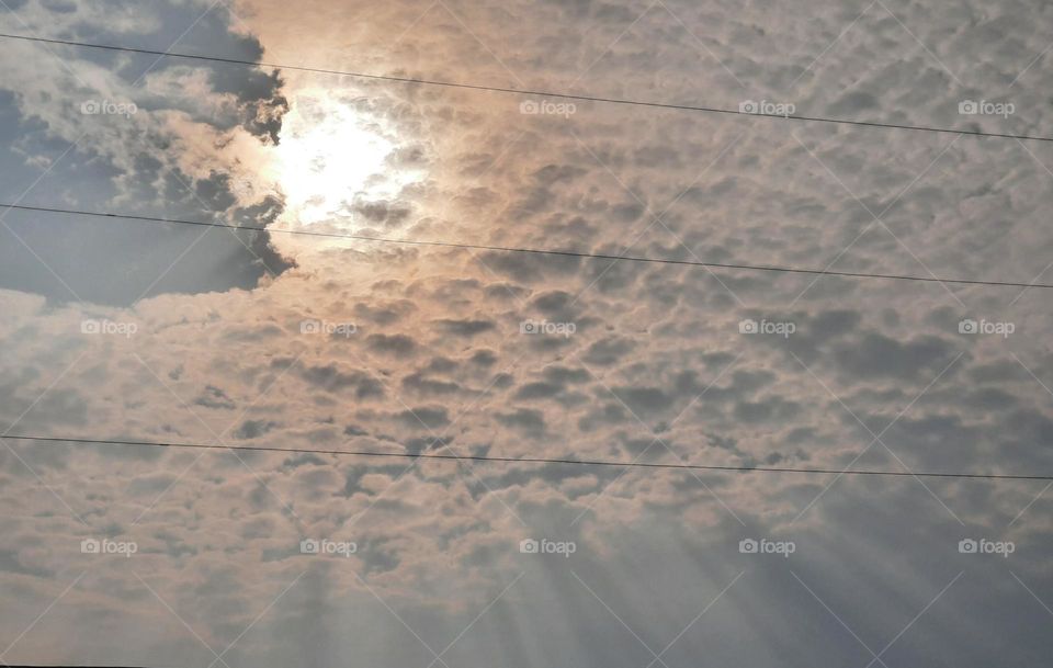 sun rays through the clouds