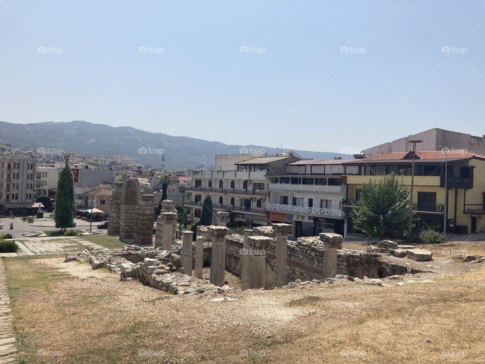 Sunny holidays I’m Turkey. Walk in the cute city and charming streets by the beach in Kusadasi. perfect blue sky and ocean view. Beach and the shore. To travel is to live. Gorgeous tall palm trees.