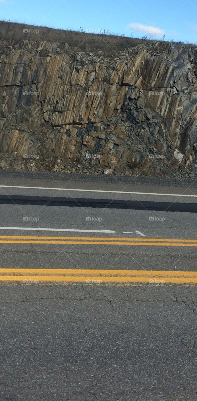 Rock face and road 