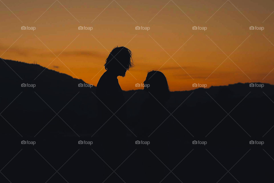 Silhouette of a man and a woman.