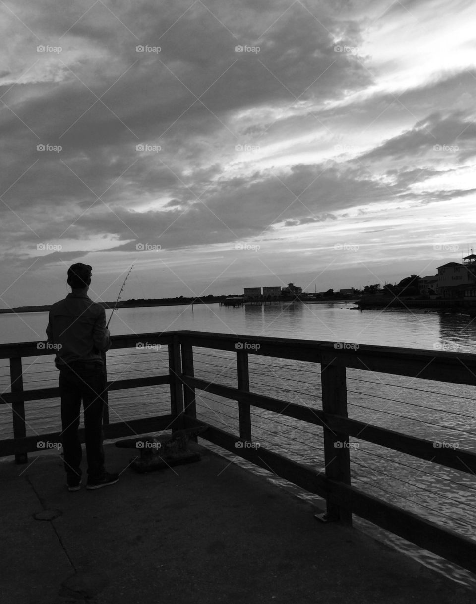 Boy Fishing off Pier