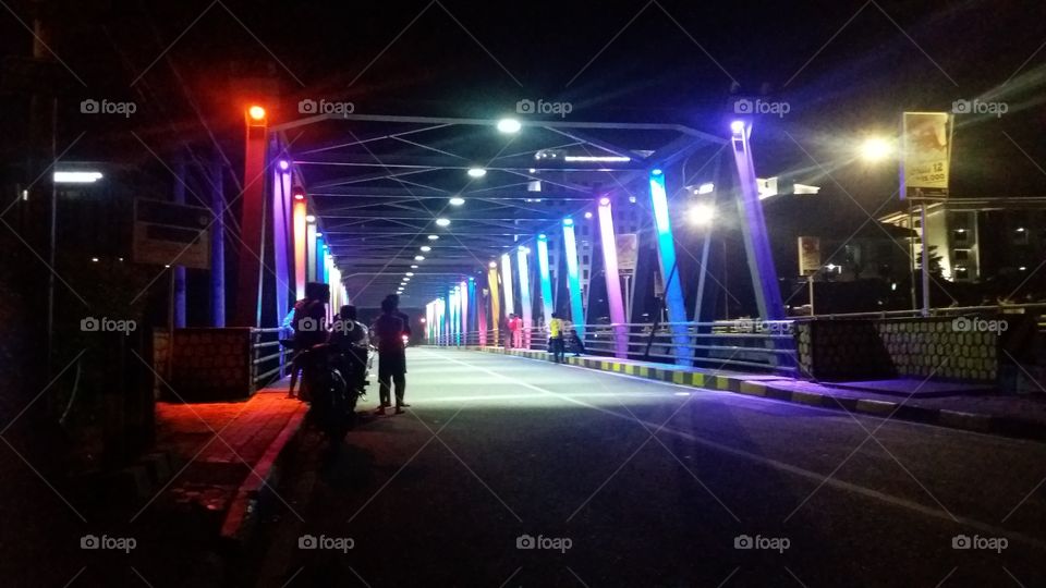 colorful lights on the bridge in poor areas