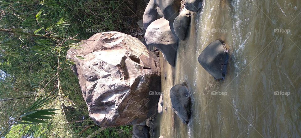 This big rock is in the middle of the river