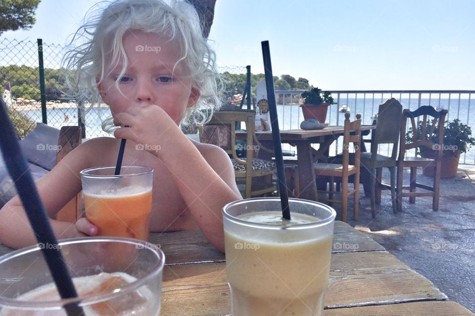 Boy drinking a smoothies
