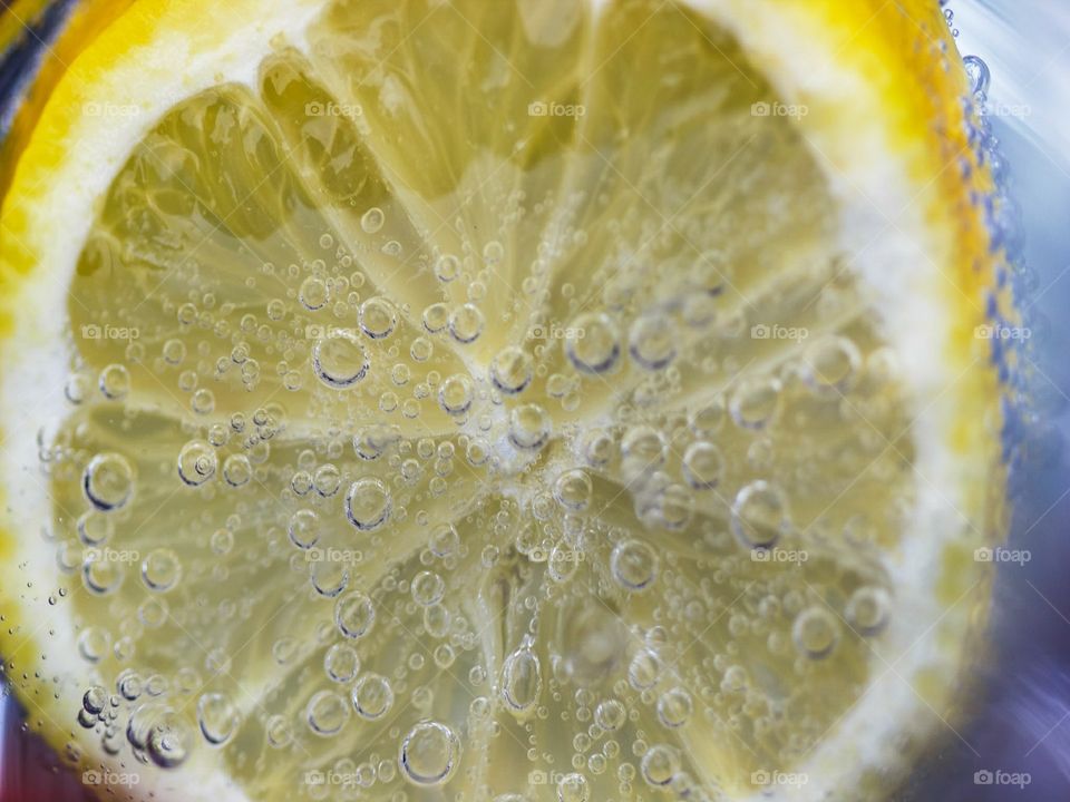 bubbles on lemon in water