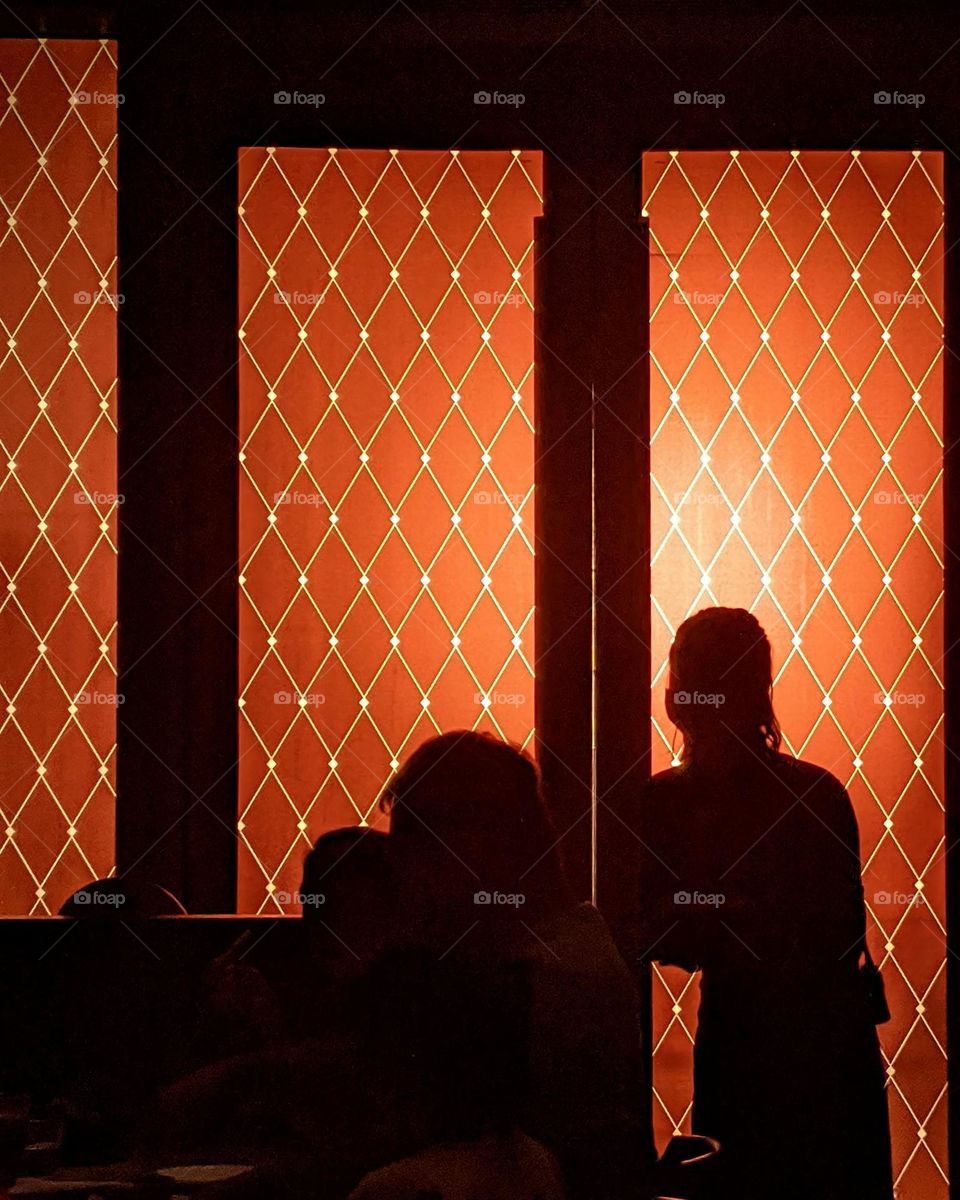 A restaurant filled with orange light