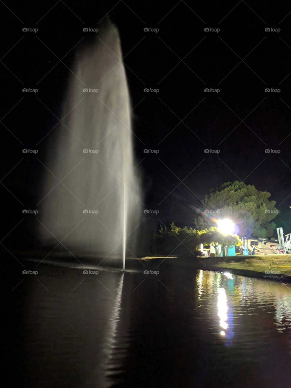 work light on a pond fountain