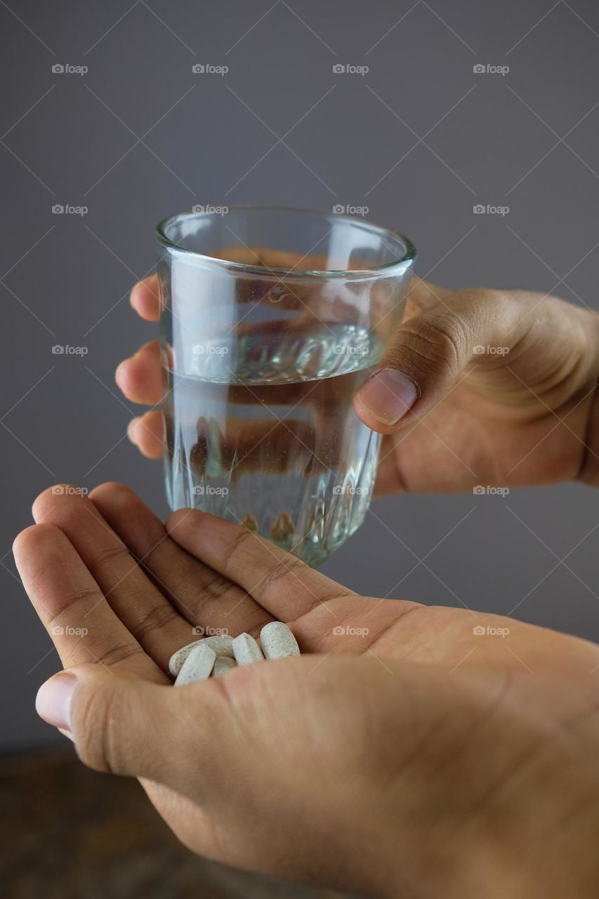 Tablets and glass of water