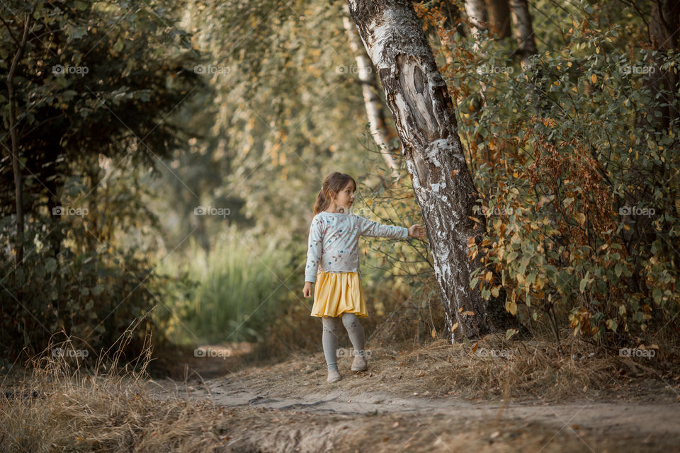 Little girl portrait at autumn day