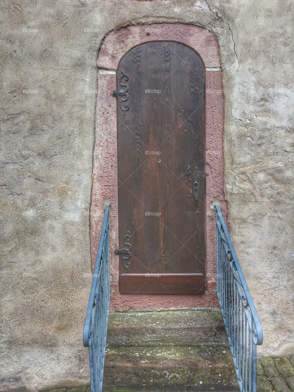 Old wooden door - a side entrance of a church in a Black Forest City in Germany
