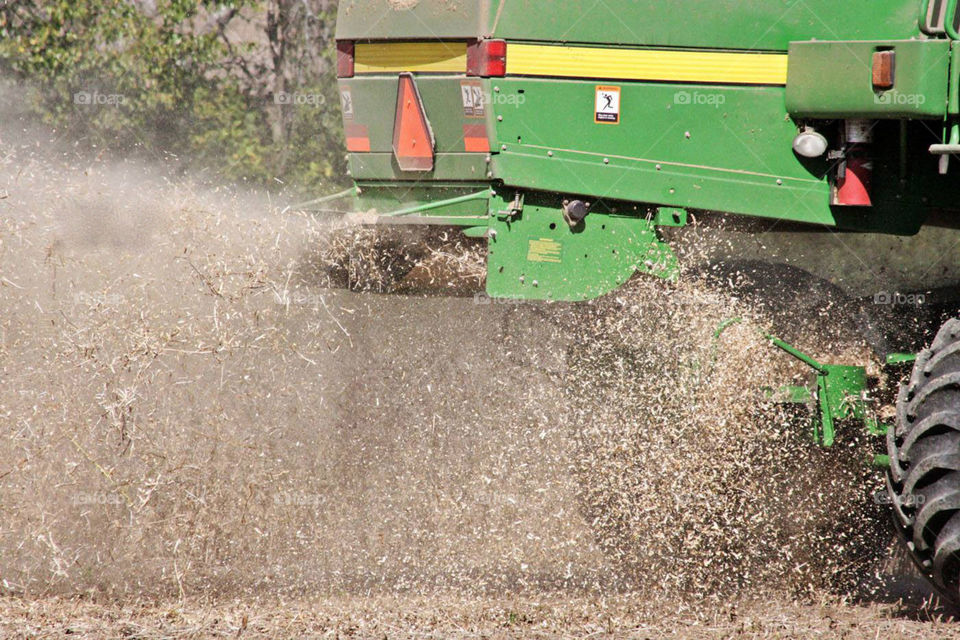 Tractor harvesting crops