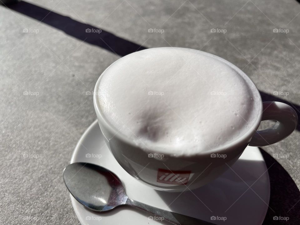 cup of cappuccino on tabletop 