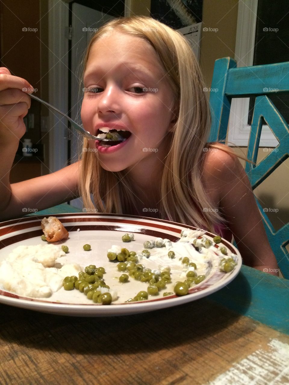 Little girl eating dinner 