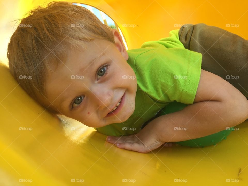 My sweet little man crawling through a tunnel at the park. 