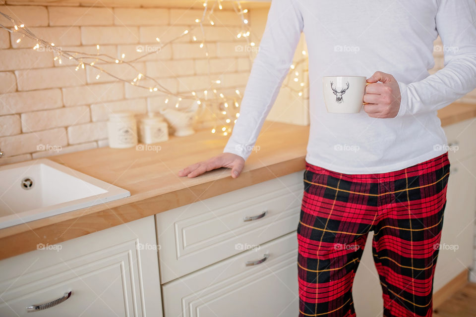 cup of coffee in a cozy festive Christmas atmosphere