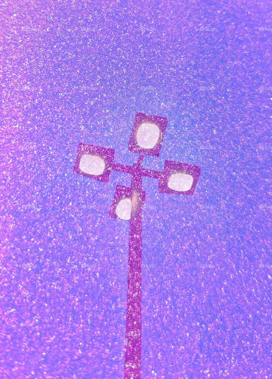 Snow in a winter sky in a lamp light