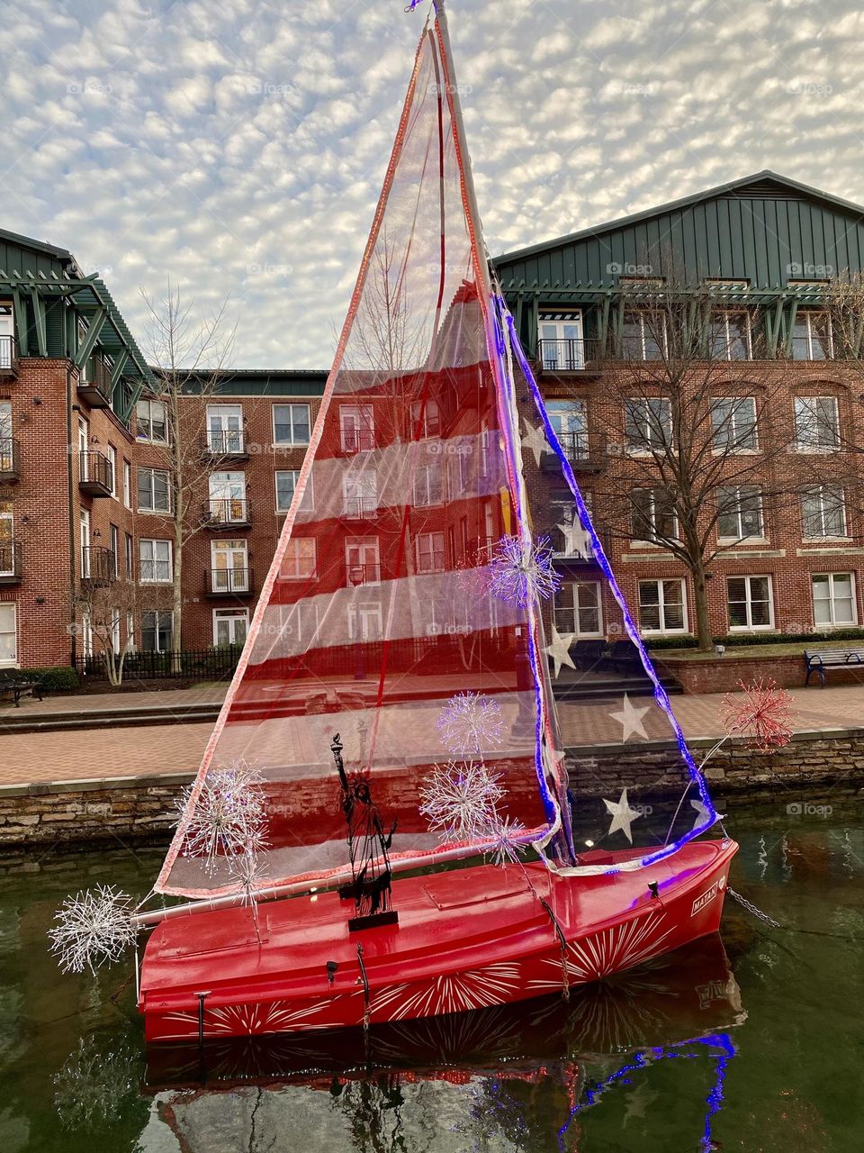 A model boat on a canal during an annual event in Frederick Maryland