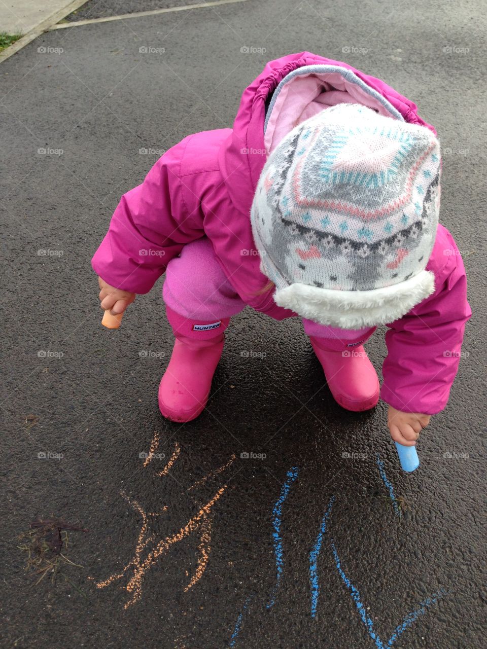 Baby playing with chalk