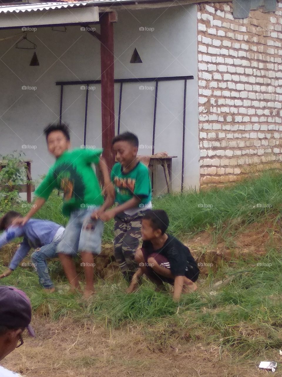 The village boy is happy to play happily