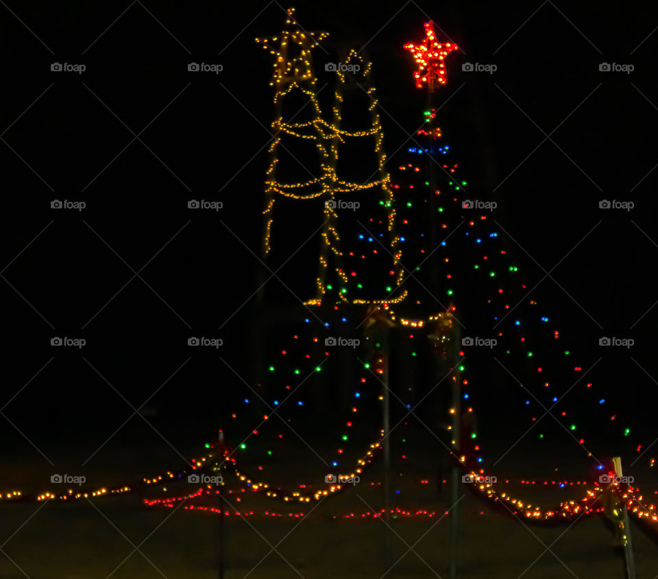 Pretty Christmas light display against black background. 