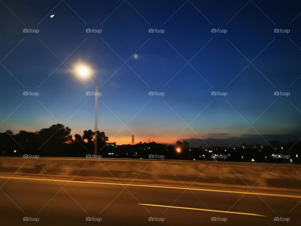 gradient sky beside the road