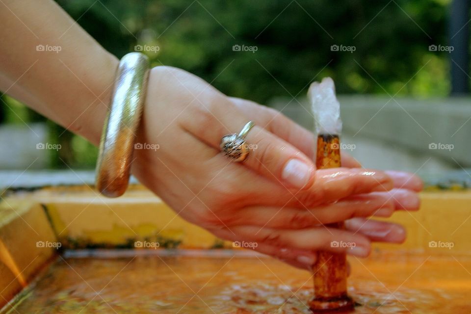  washing hands in fountain