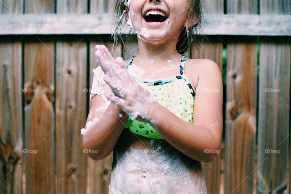 Little girl with shaving cream 