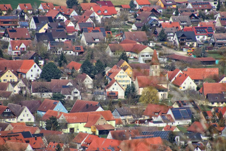 Aerial view of a small town with many red roofs