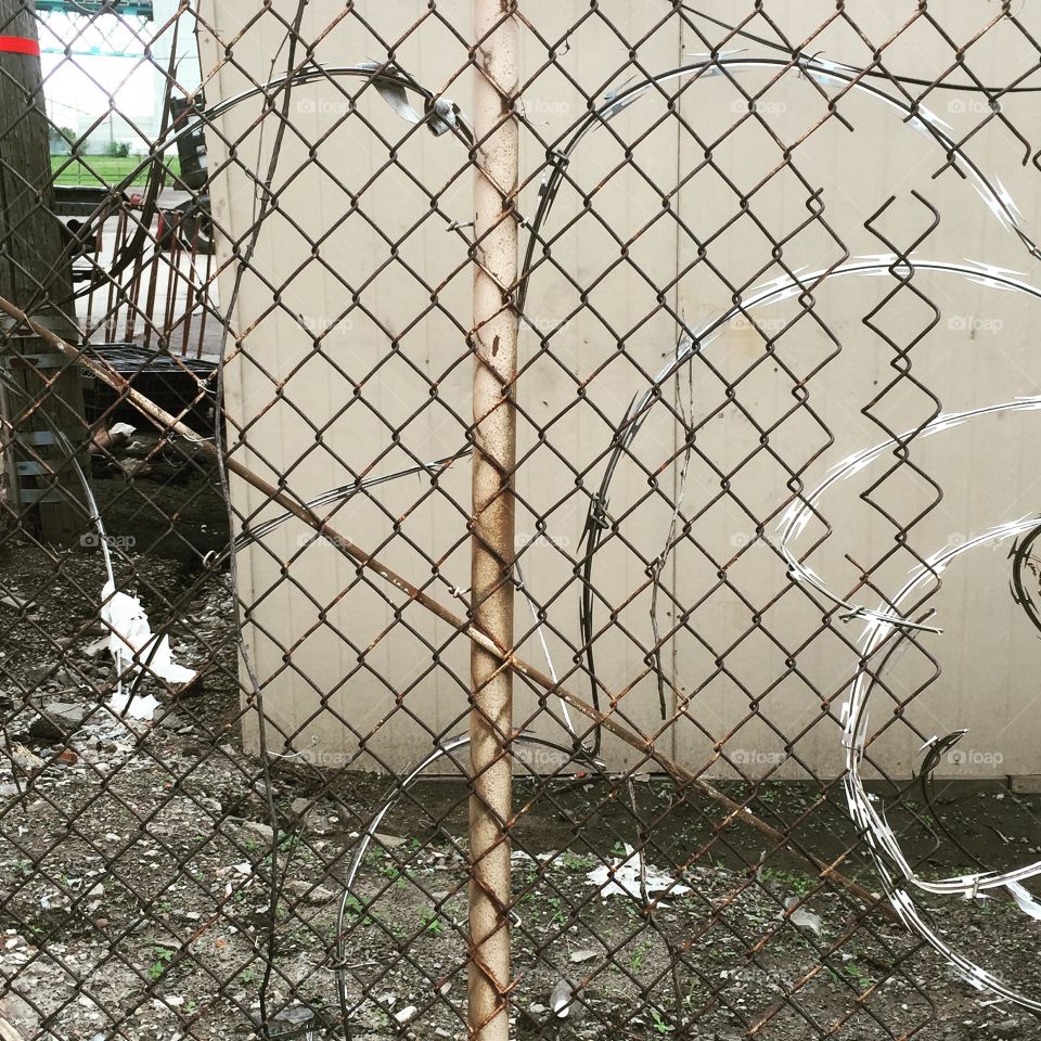 Barbed-wire parking lot.