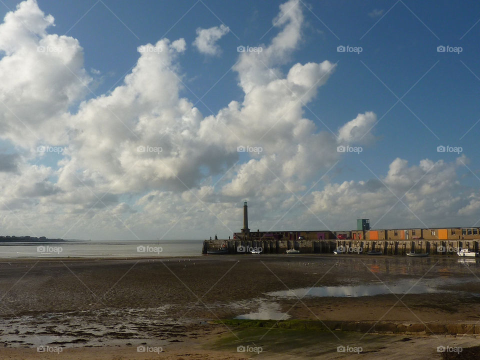 beach sky clouds harbour by lizajones