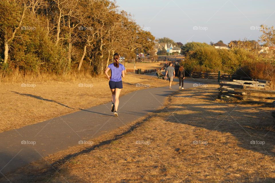 Woman running on the path 