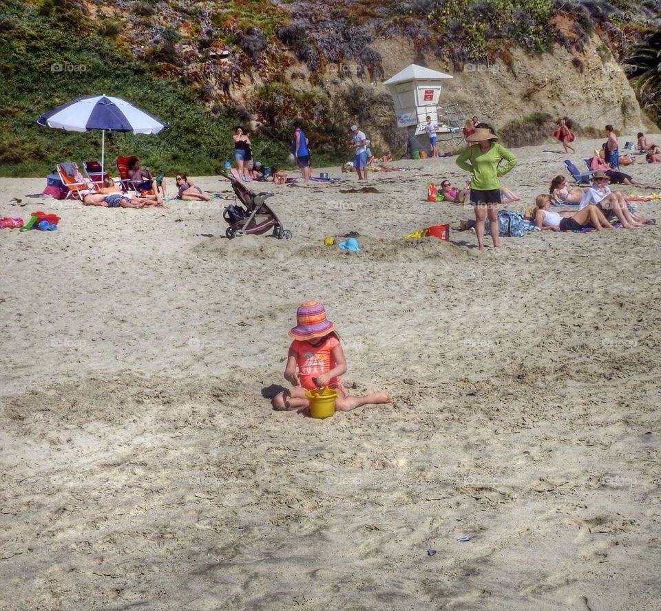 Girl playing at the beach 