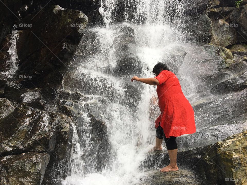 Portrait of a women In front of water falls