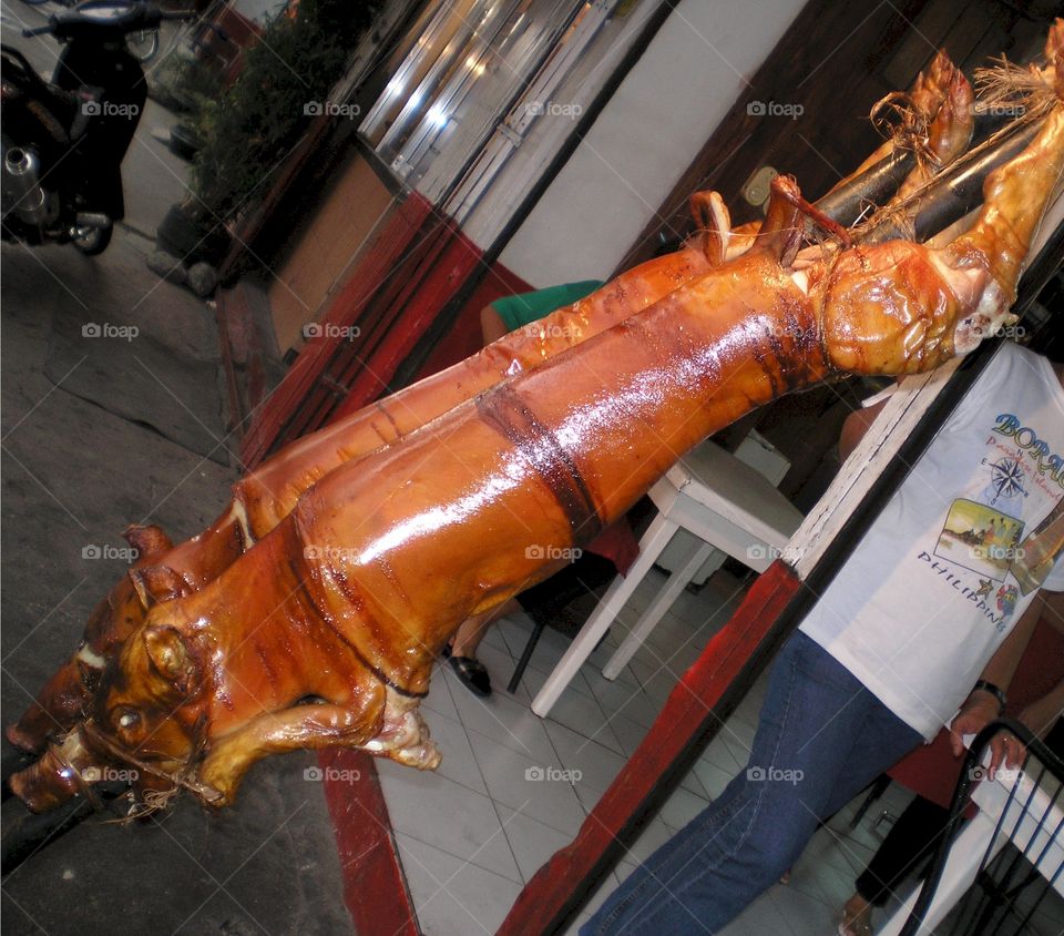 Lechon. spit - roasted pig in the Philippines 