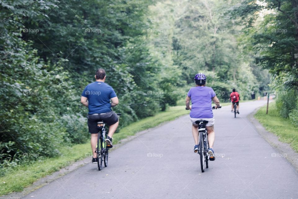 Adults on bikes