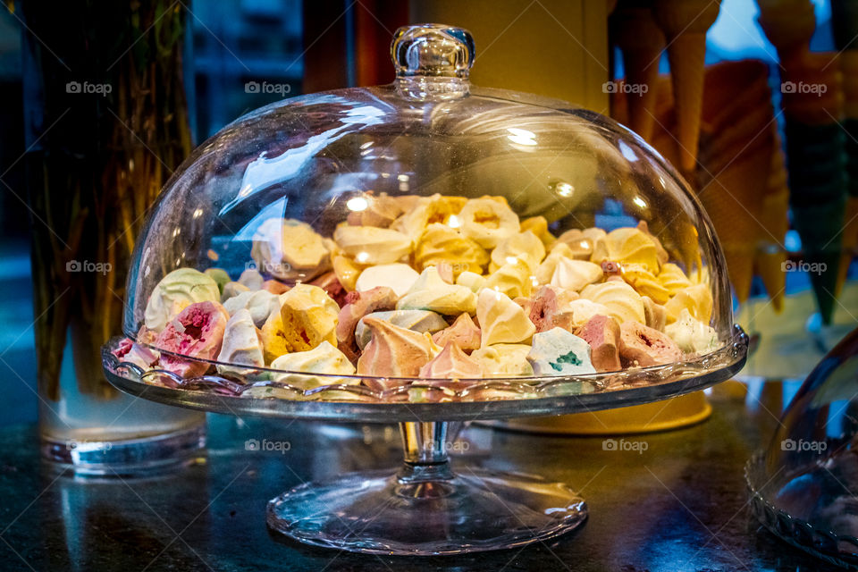 Pastry shop - "Puslice under an oval glass lid on a raised pedestal"